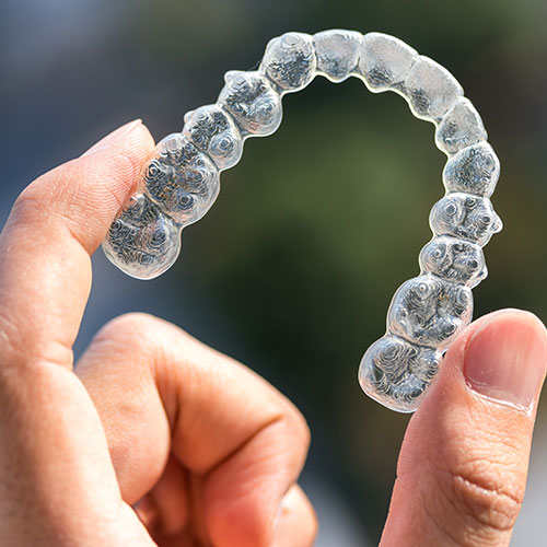 clear aligner holded in hand
